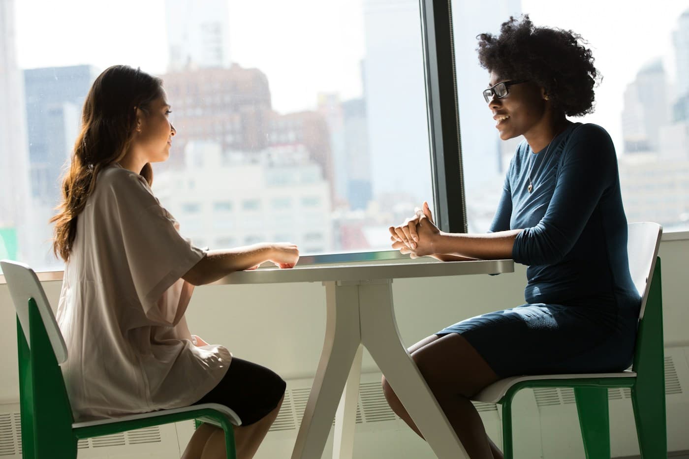 A candidate and interviewer having a thoughtful conversation