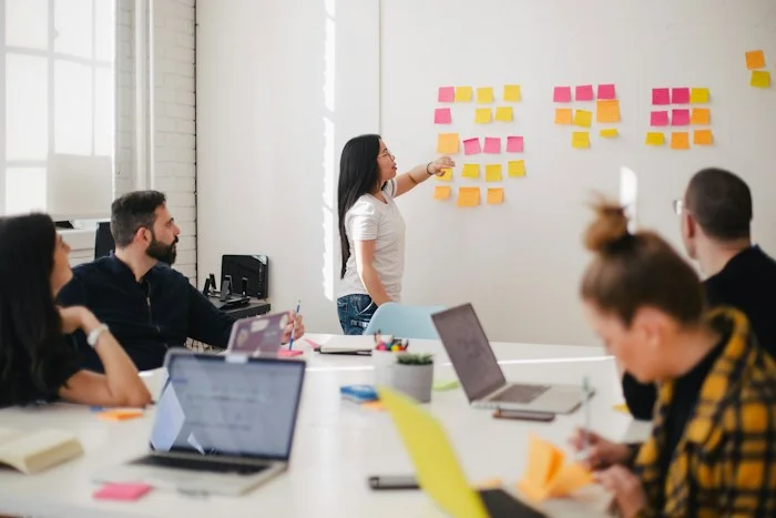A team discussing priorities in a meeting room